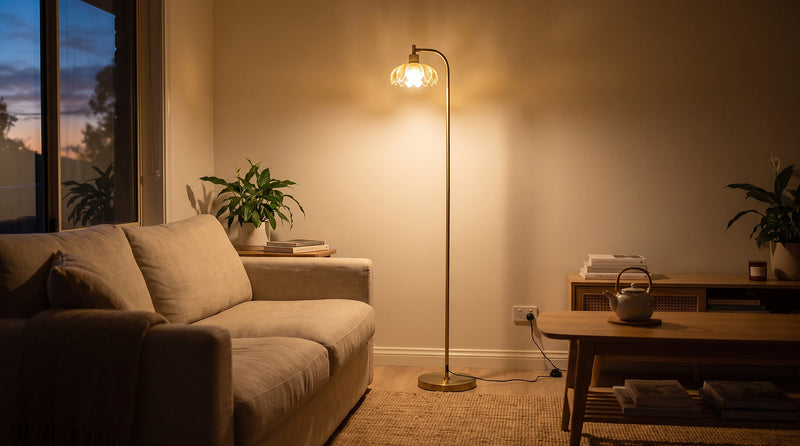 Camille amber petal glass floor lamp glowing beside a linen sofa in an Australian living room