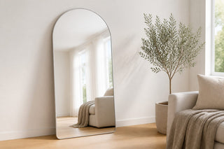 Mirror sale NZ, Magna Alba arched full length mirror with a thin white frame leaning against the wall of a bright New Zealand living room during the C&F Creation store opening sale