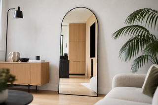 Black vs gold frame mirror NZ — black arched Titan X in a modern Kiwi living room