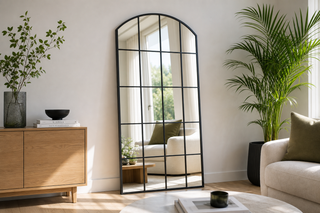 Grid mirror NZ — Le Beau black arched window pane full-length mirror in a modern Kiwi living room