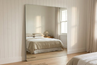 Monarch X frameless rectangular full length mirror 180 x 120cm reflecting a sunlit NZ bedroom with every line straight and true