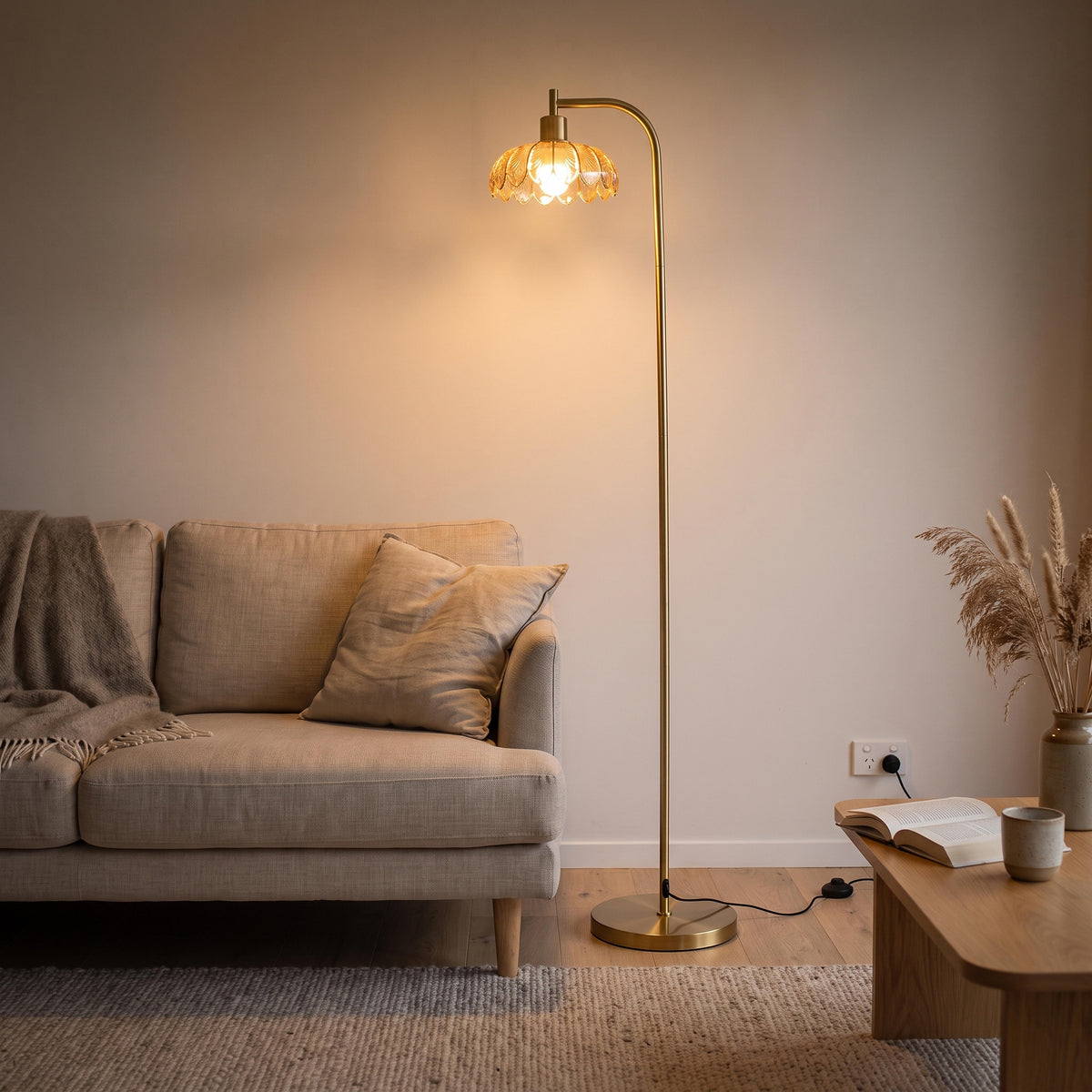 C&F Creation floor lamp glowing beside a sofa
