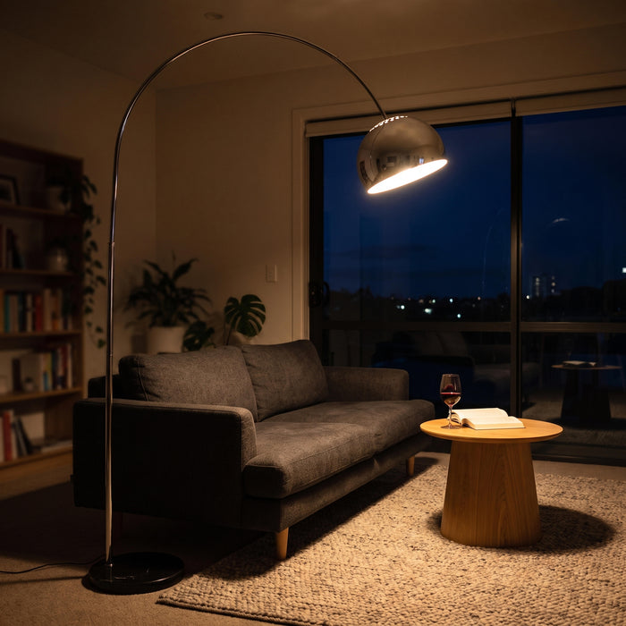 Cosmo Chrome Marble Base Floor Lamp switched on in the evening, casting a warm glow with the night lights on
