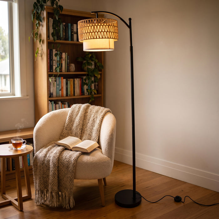 Rousseau Rattan Weave Floor Lamp lighting a relaxed reading corner next to an armchair