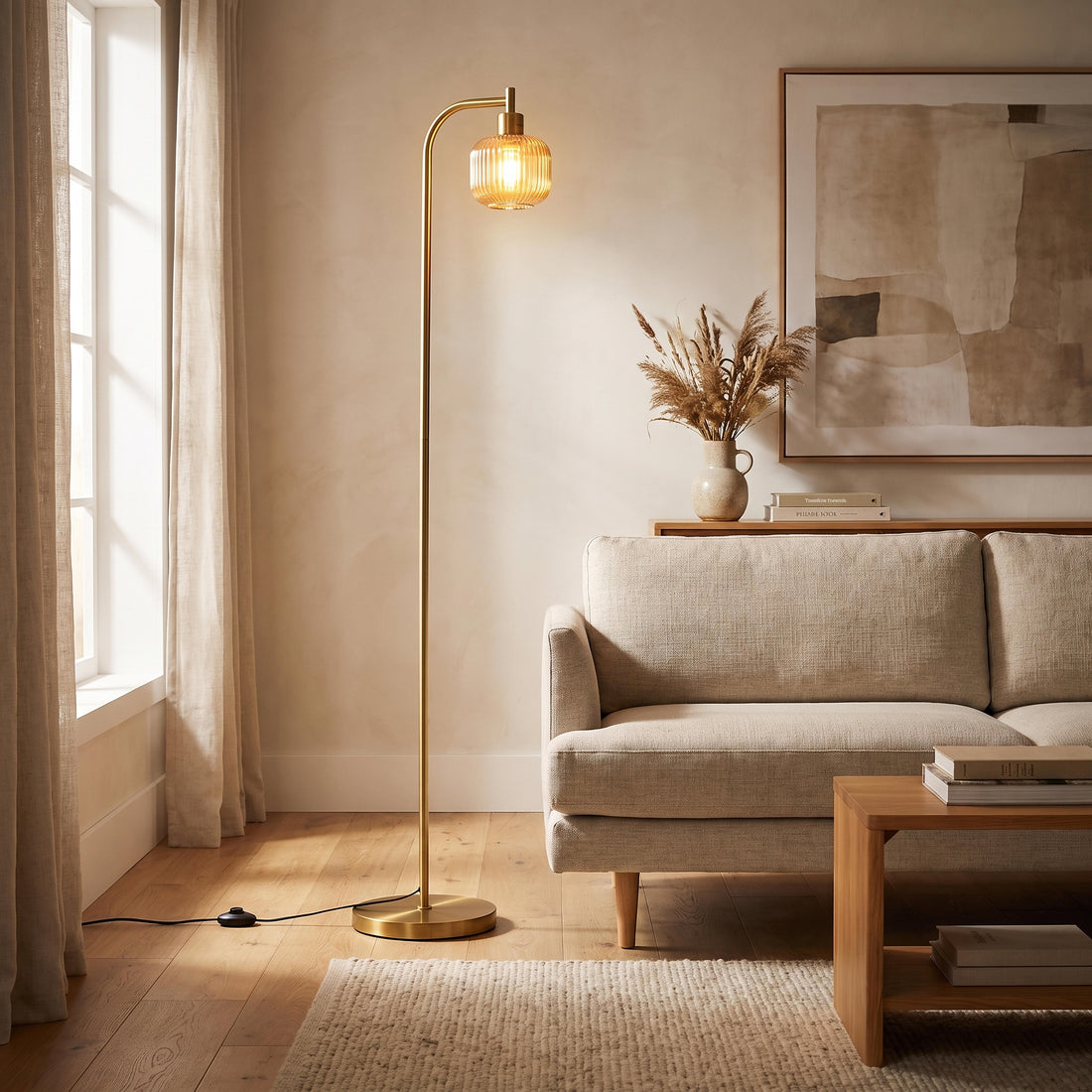 Solara Fluted Lantern Floor Lamp glowing warm beside a sofa in a New Zealand living room