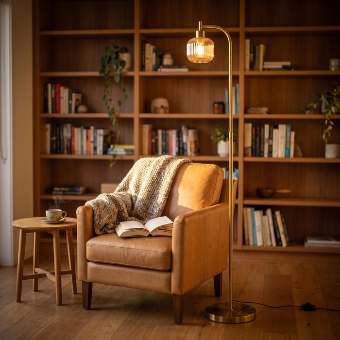 Solara Fluted Lantern Floor Lamp lighting a comfortable armchair in a quiet reading corner