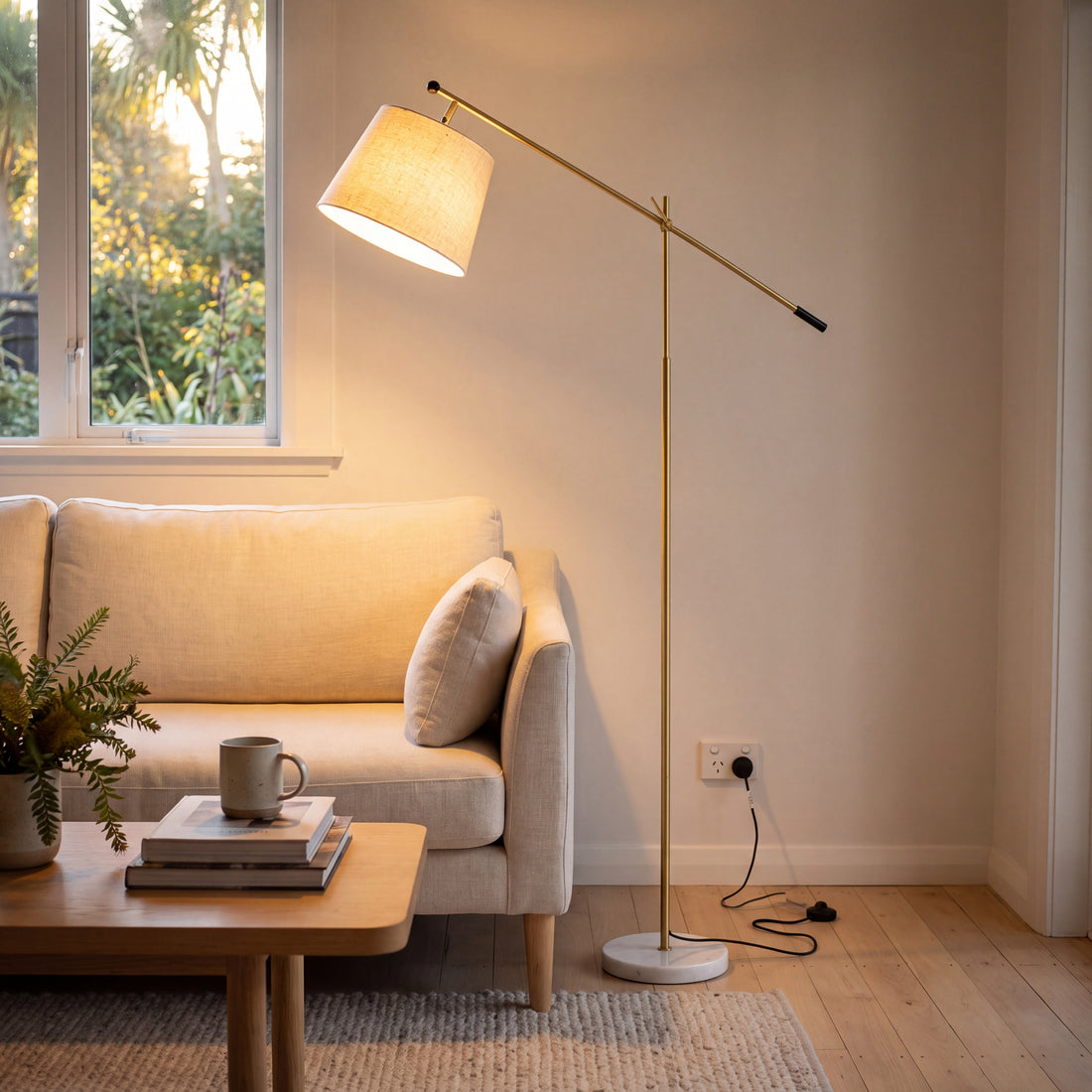 Vienna Brass Marble Base Floor Lamp beside a cream sofa in a New Zealand living room